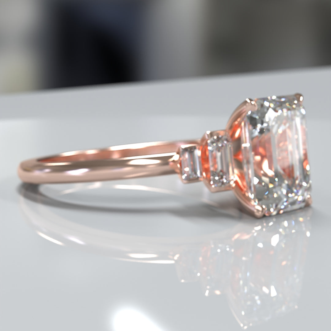 emerald-cut five-stone engagement ring with tapered baguette side diamonds shown from multiple angles