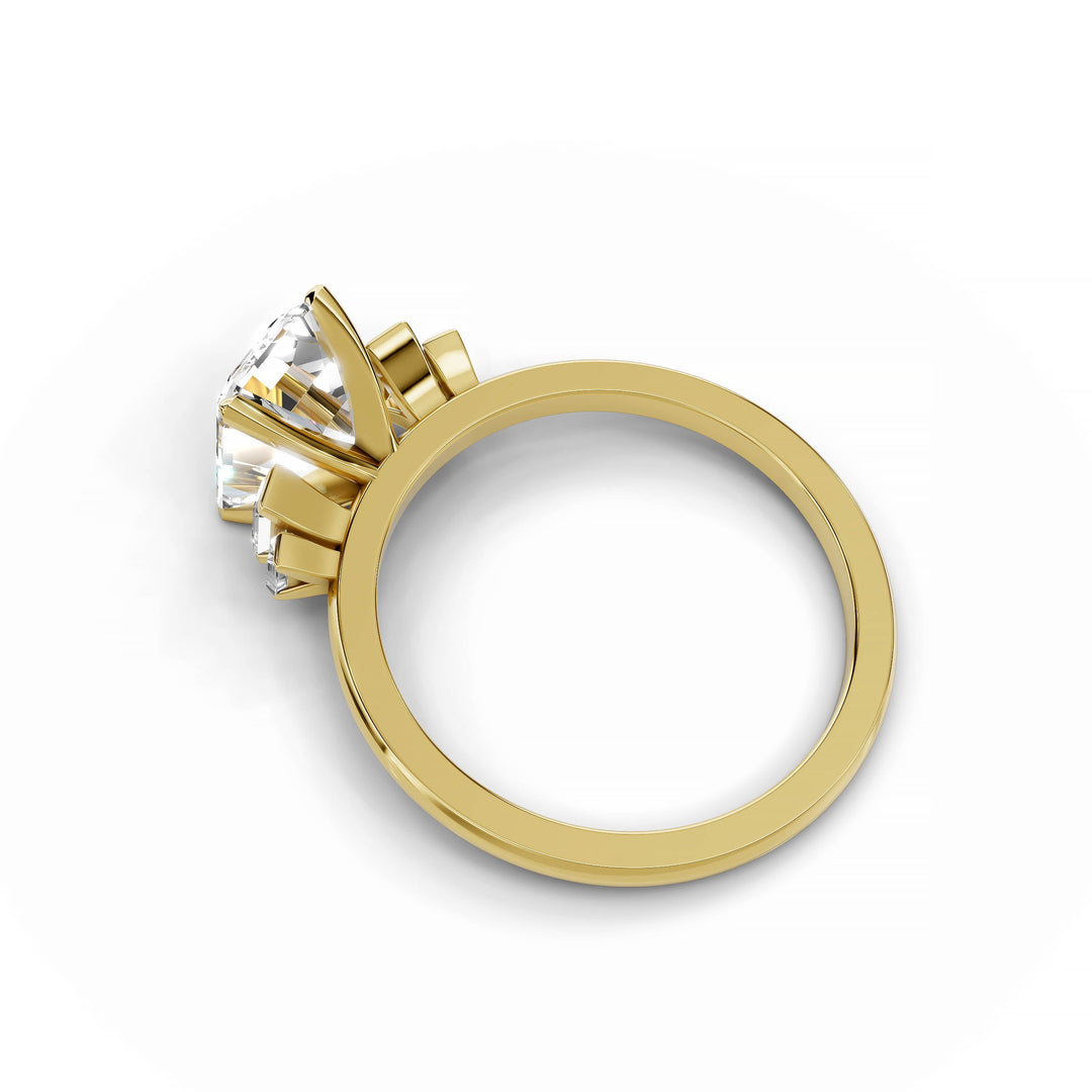 Emerald cut diamond five stone engagement ring in yellow gold.