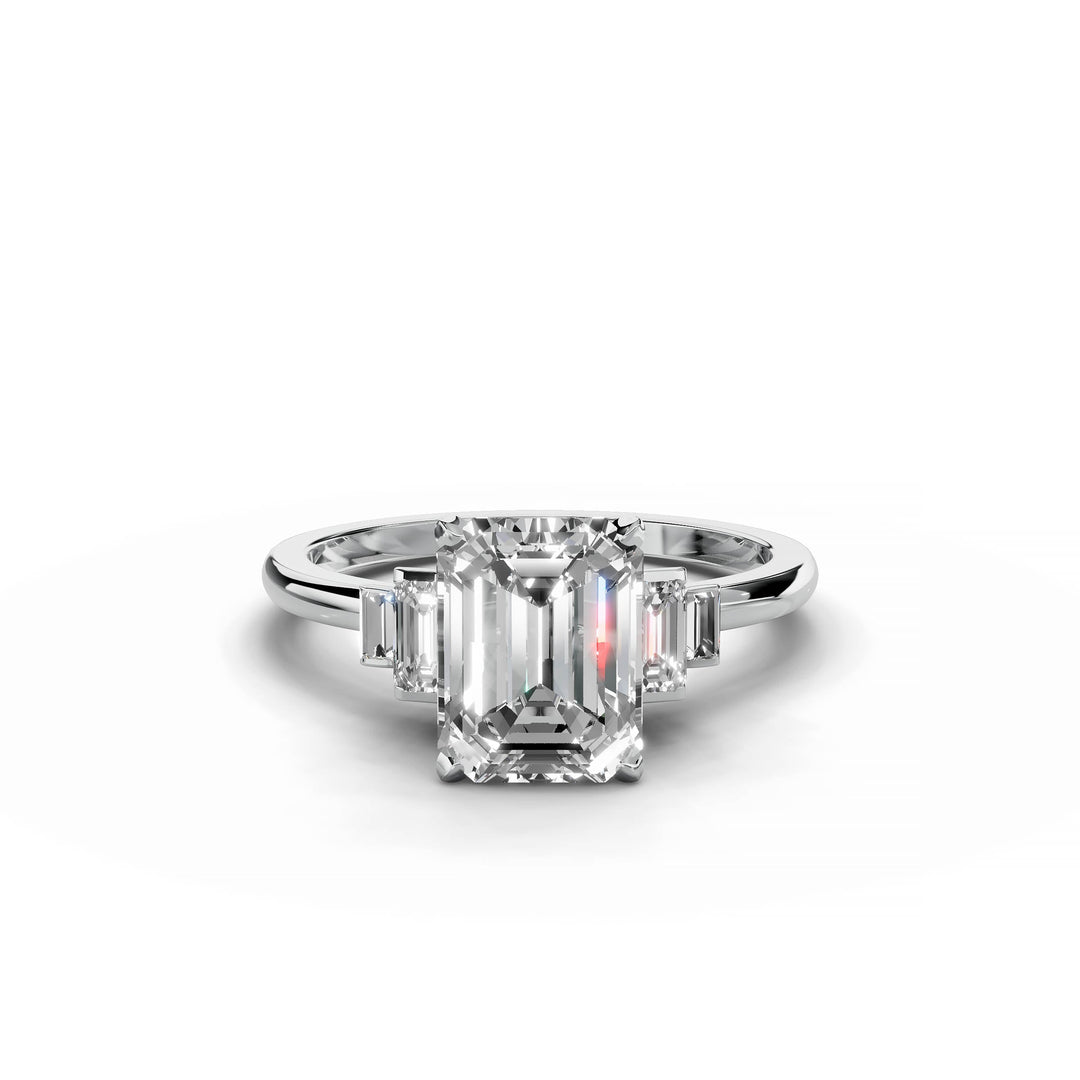 Emerald cut diamond five stone engagement ring in white gold.