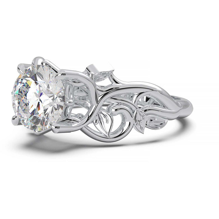 Engagement ring with a 1-carat round-cut lab grown diamond and intricate vine design.