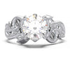 Engagement ring with a 1-carat round-cut lab grown diamond and intricate vine design.