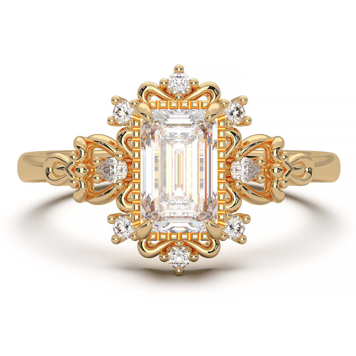 Vintage engagement ring with emerald cut diamond and filigree details.