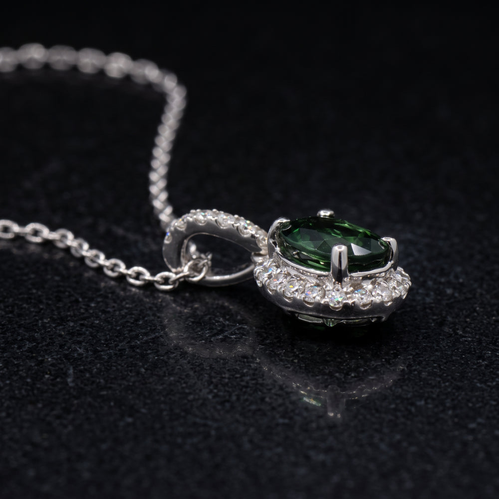 Natural oval green sapphire pendant with diamond halo in 14k white gold, 1.06ct sapphire with 0.23ct diamonds.