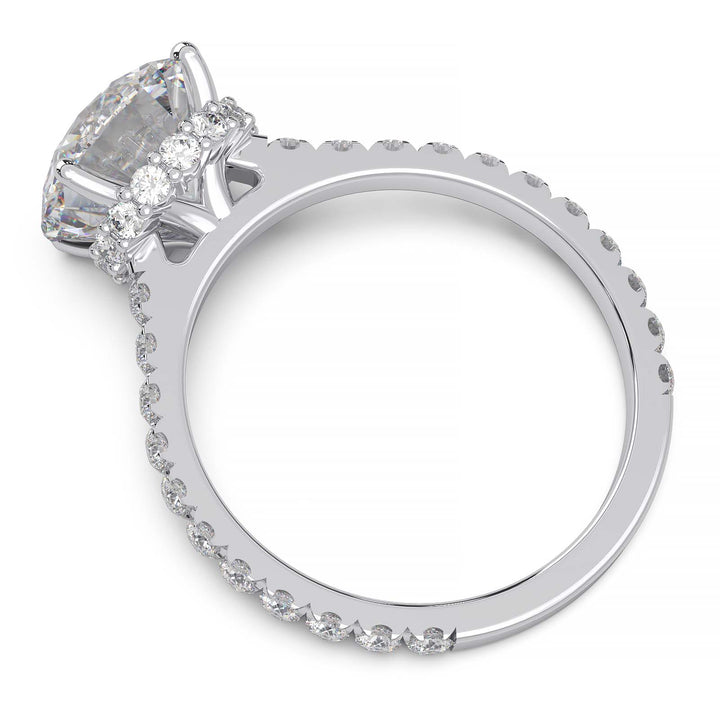 Round lab grown diamond ring with hidden halo, cathedral setting, and pave-set band.