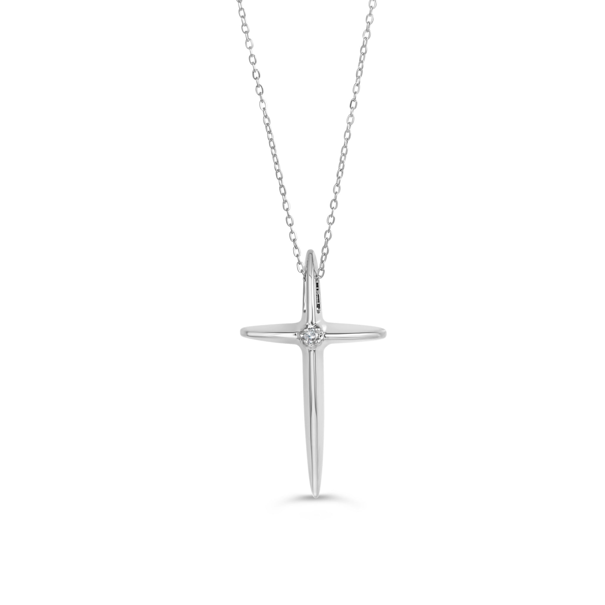 White gold cross pendant necklace with a single diamond accent on a delicate chain.