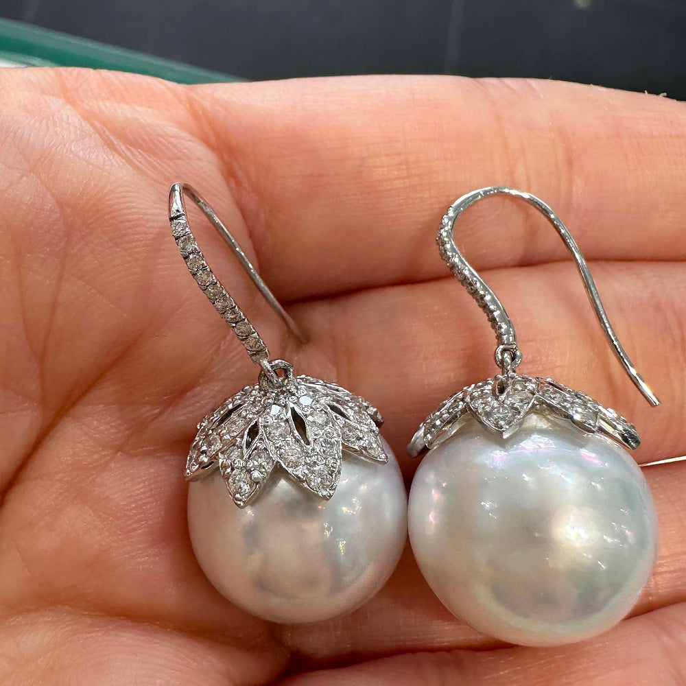 South Sea pearl drop earrings with 15.7mm white pearls, 14K white gold, and natural diamonds. Clean, blemish-free surface.