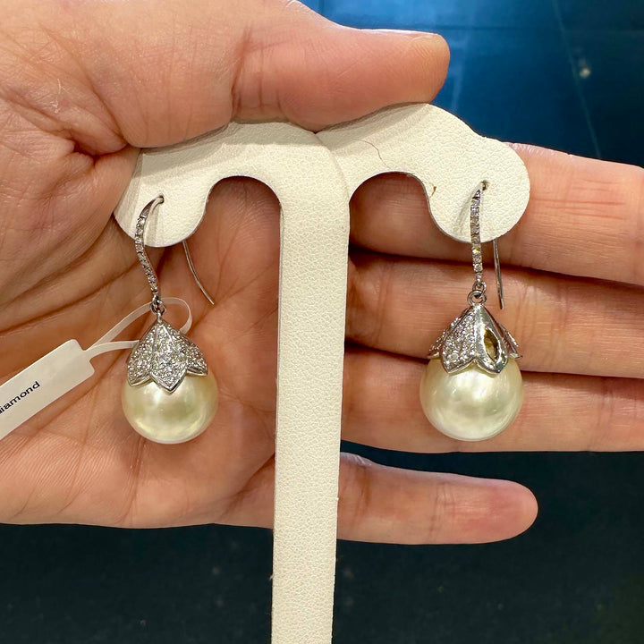 South Sea pearl earrings with 15mm light champagne pearls, 14K white gold, and small natural diamonds.