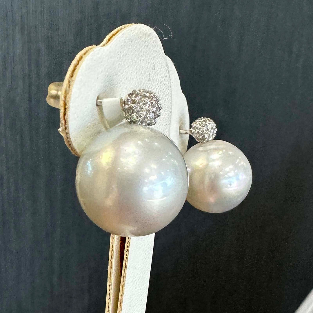 South Sea pearl stud earrings with 14.2mm white pearls, 18K white gold, and 0.28 ct natural diamonds.