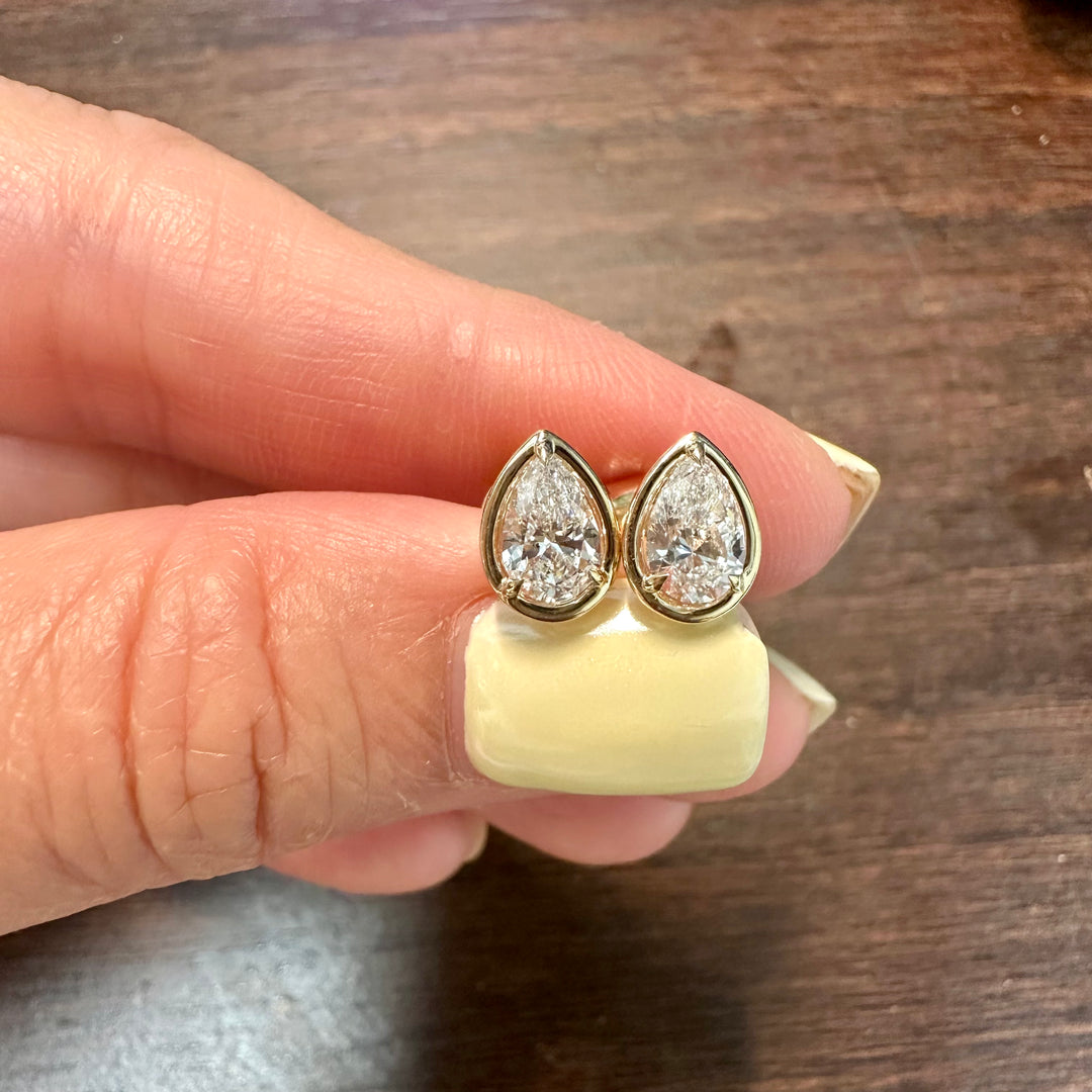 Certified lab grown pear diamond stud earrings in 14K yellow gold bezel setting