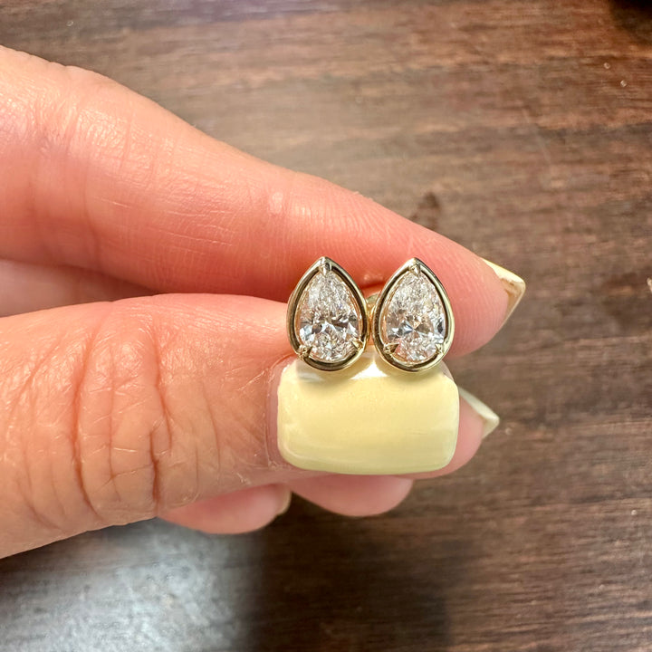 Certified lab grown pear diamond stud earrings in 14K yellow gold bezel setting