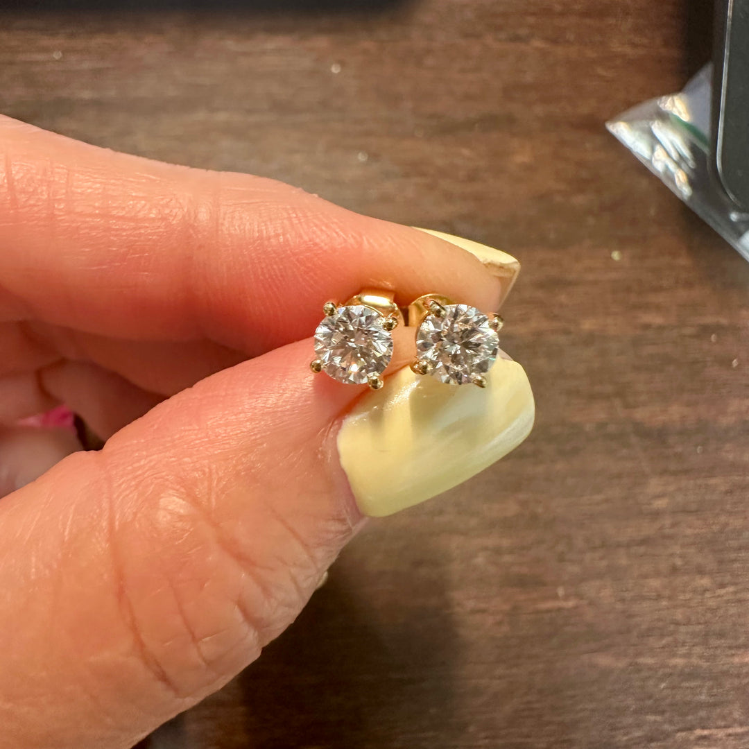 Certified round lab grown diamond stud earrings in 14K yellow gold prong setting

