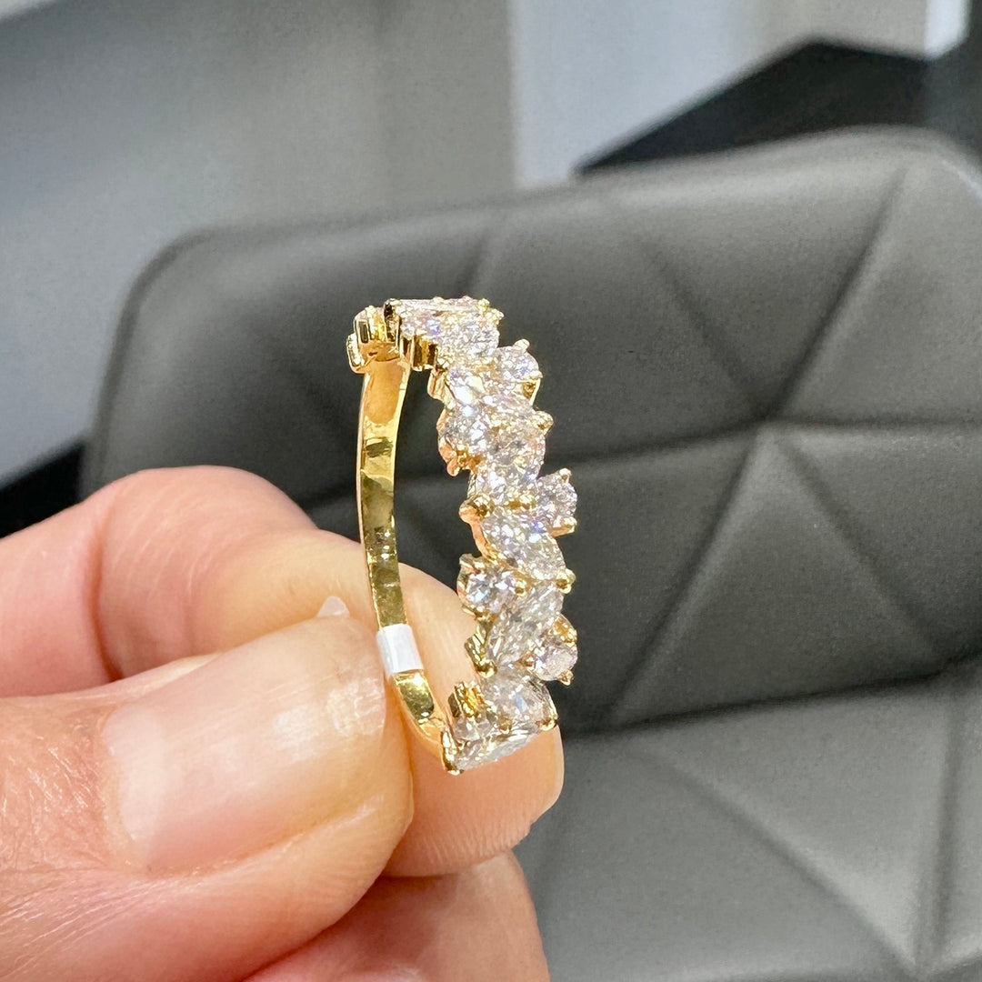 14K yellow gold wedding band with marquise and round lab-grown diamonds in an elegant setting.