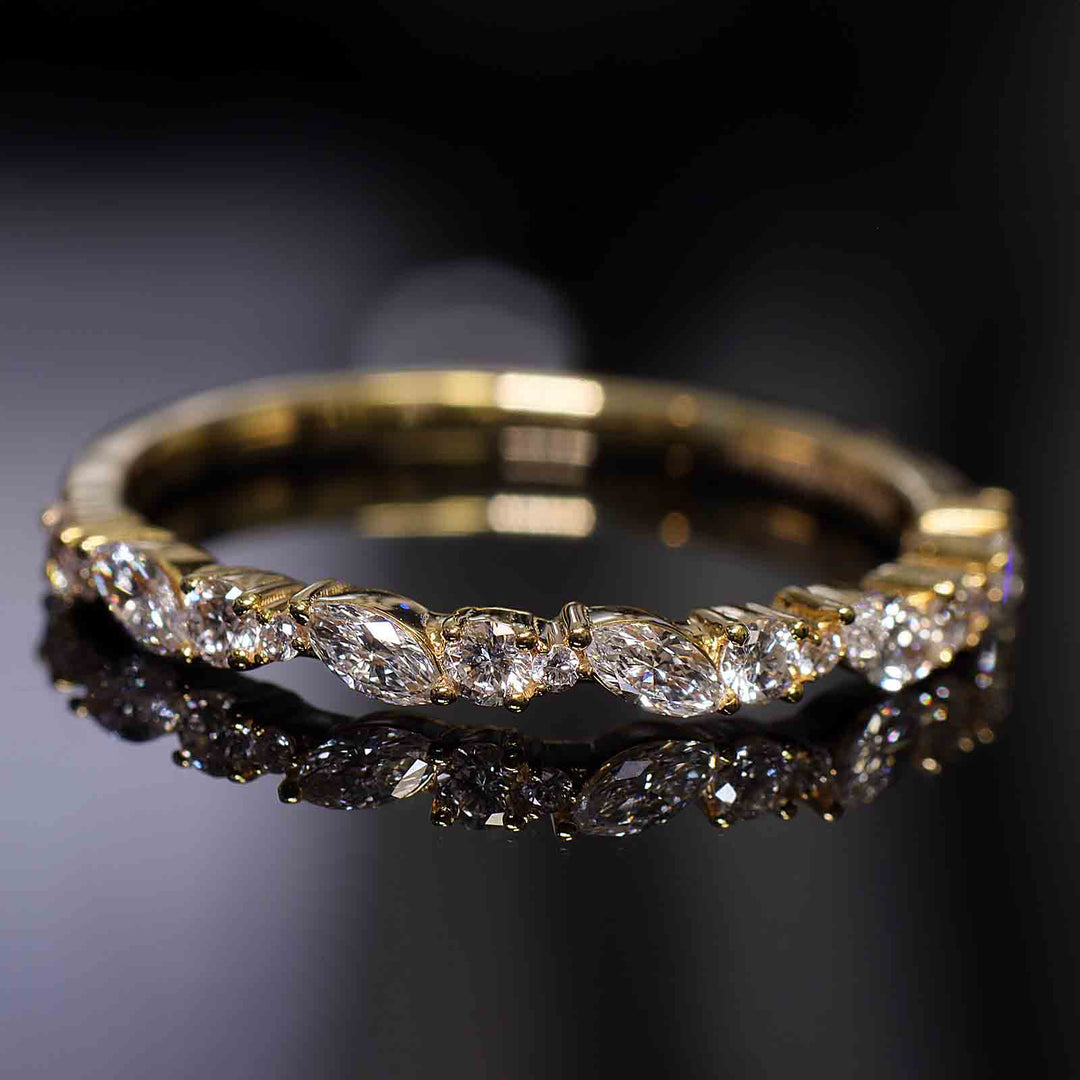 Eternity band with round and marquise lab-grown diamonds in shared prong setting.