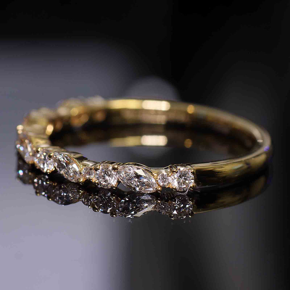 Eternity band with round and marquise lab-grown diamonds in shared prong setting.