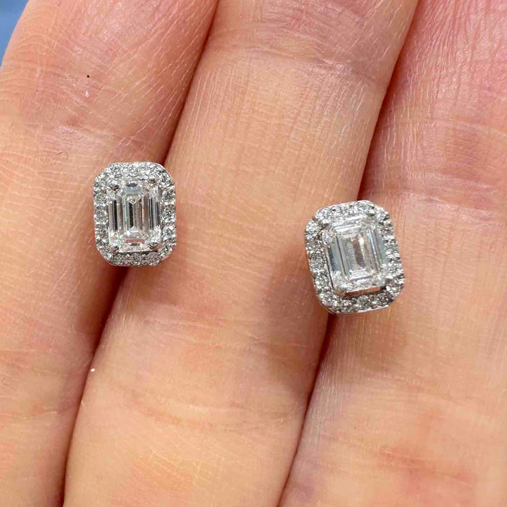 10K gold stud earrings with emerald-cut lab diamonds, VVS clarity, G-H color, and halo setting.