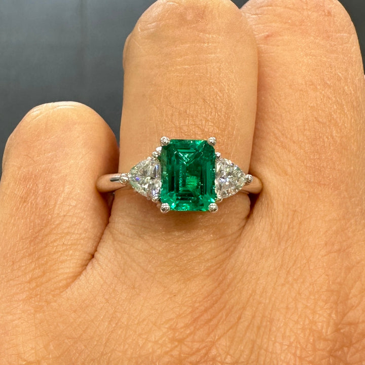 Lab-grown emerald and trillion moissanite ring in 14K white gold