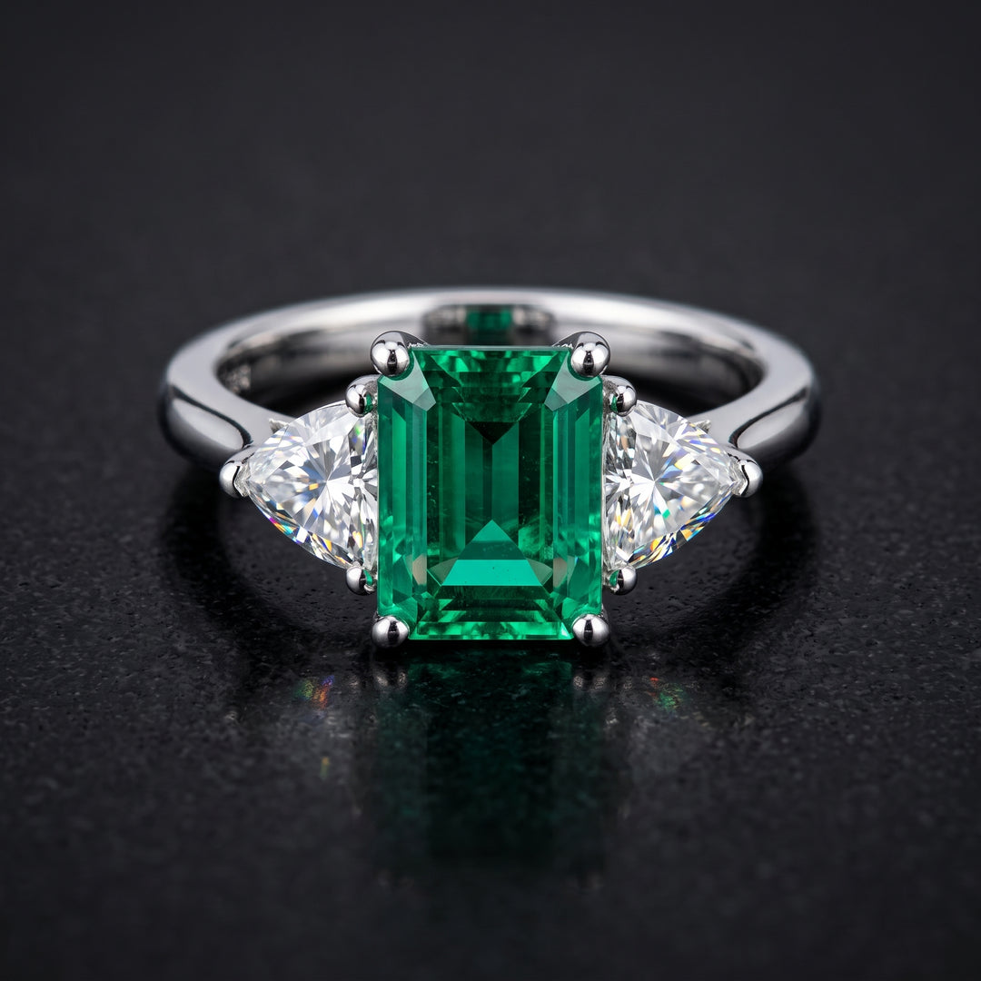 Lab-grown emerald ring with moissanite accents set in 14K white gold.