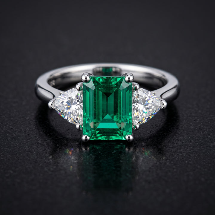 Lab-grown emerald ring with moissanite accents set in 14K white gold.