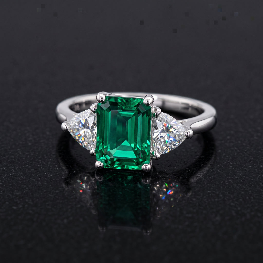 Lab-grown emerald ring with moissanite accents set in 14K white gold.