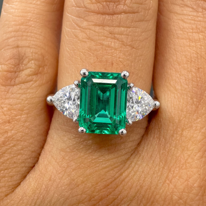Lab-grown emerald ring with moissanite accents set in 14K white gold.