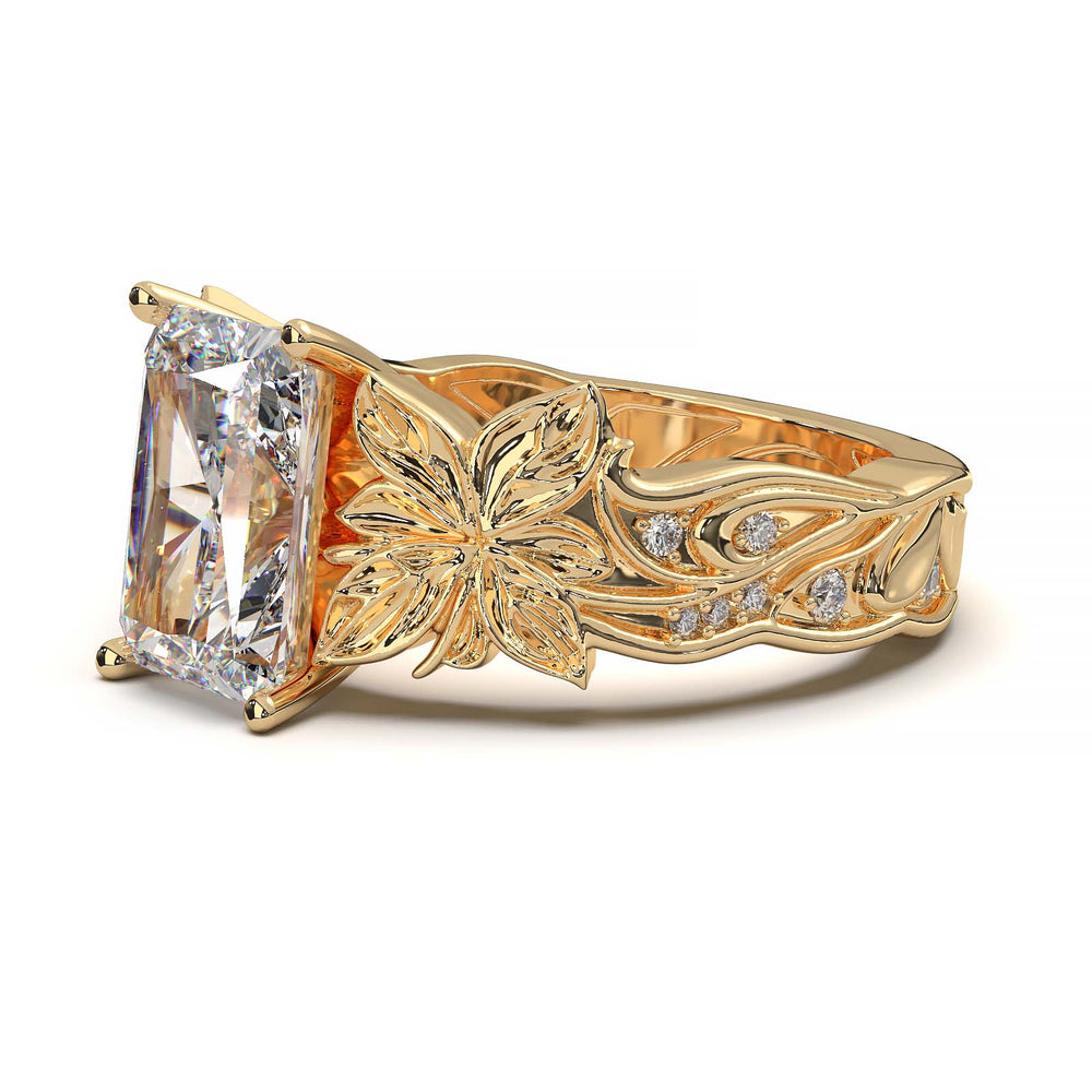 Radiant cut diamond engagement ring with floral leaf design.