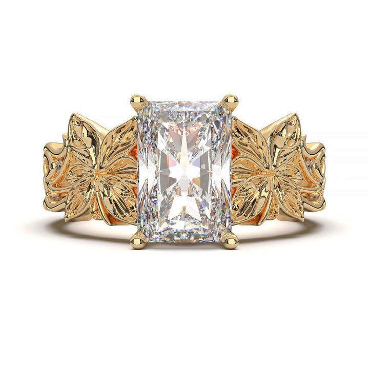 Radiant cut diamond engagement ring with floral leaf design.