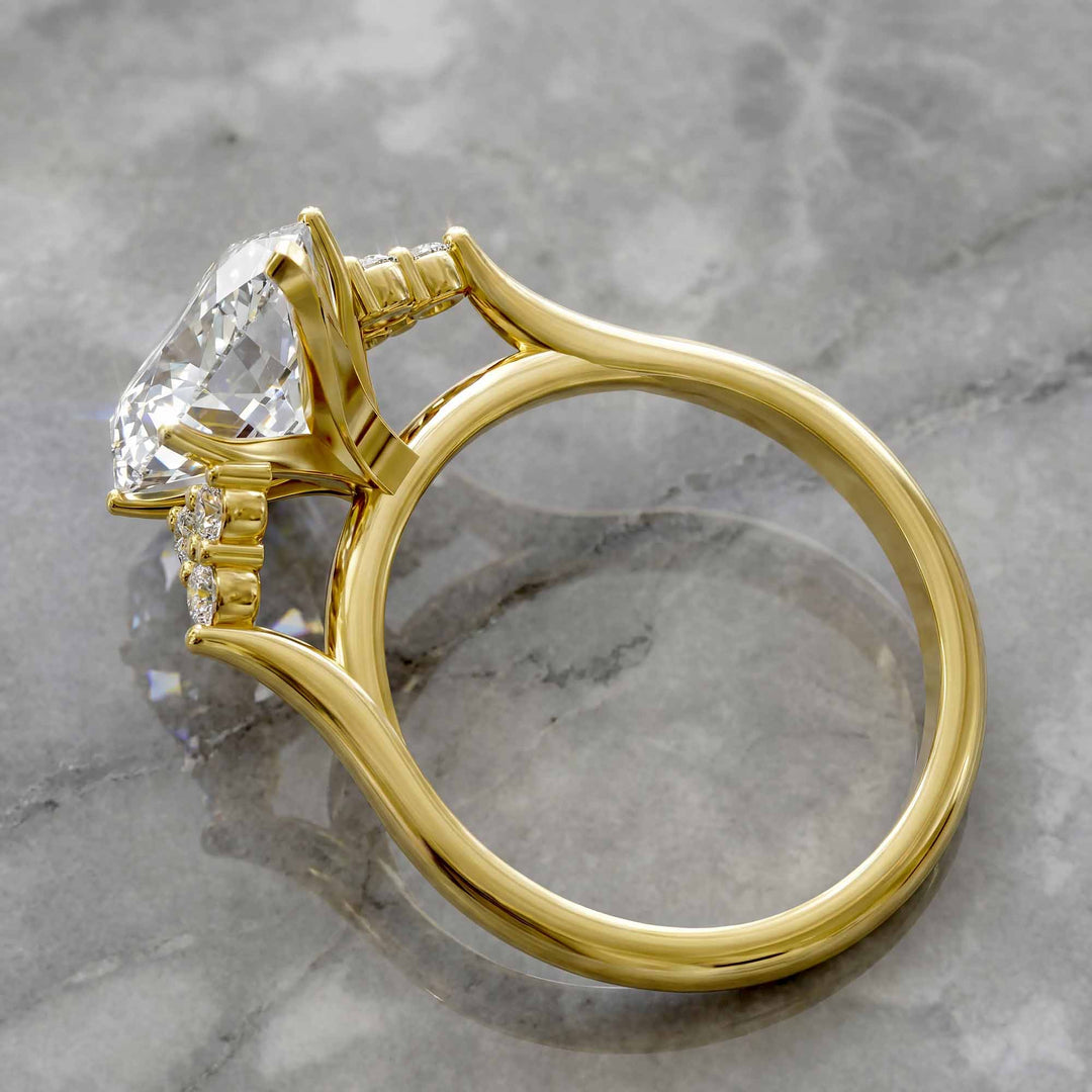 Marquise diamond engagement ring with clustered side diamonds.
