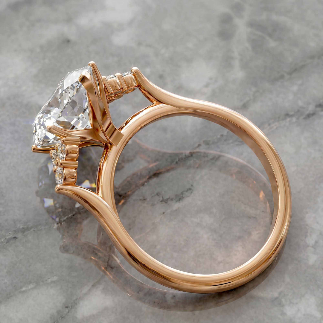 Marquise diamond engagement ring with clustered side diamonds.
