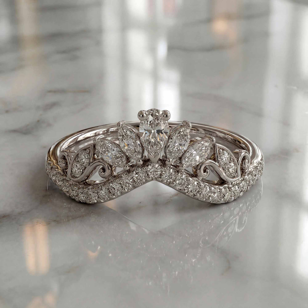 Marquise-style curved lab-grown diamond wedding band with round accent stones on display.
