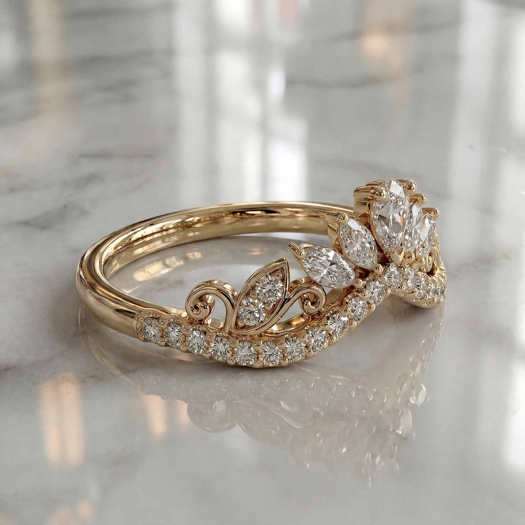 Marquise-style curved lab-grown diamond wedding band with round accent stones on display.
