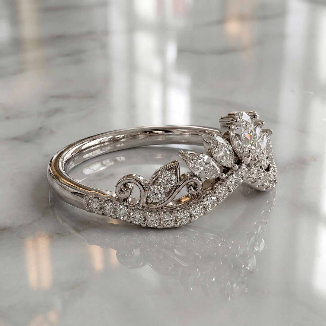 Marquise-style curved lab-grown diamond wedding band with round accent stones on display.