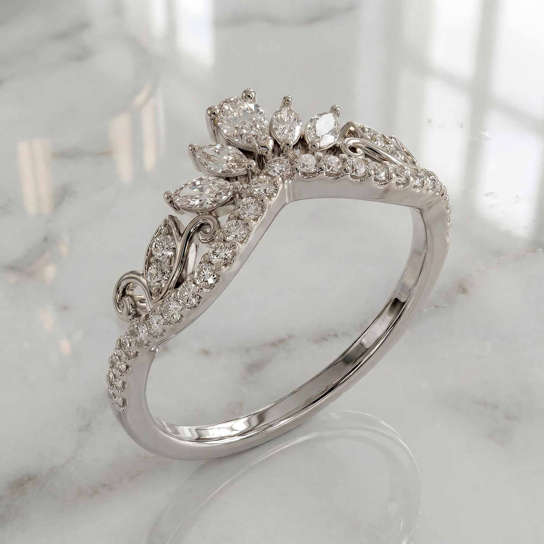 Marquise-style curved lab-grown diamond wedding band with round accent stones on display.