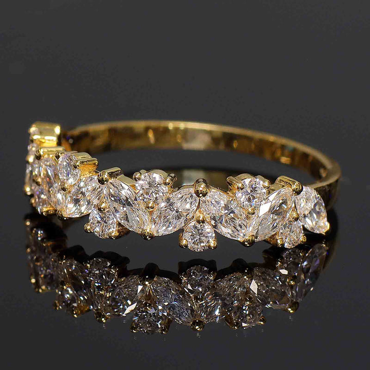 Cluster band with marquise and round lab-grown diamonds in shared prong setting.