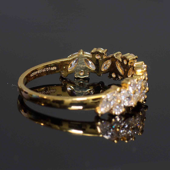 Cluster band with marquise and round lab-grown diamonds in shared prong setting.