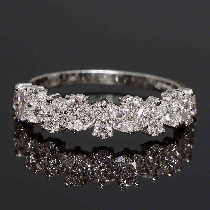 Cluster band with marquise and round lab-grown diamonds in shared prong setting.