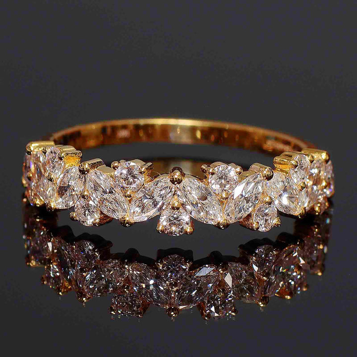 Cluster band with marquise and round lab-grown diamonds in shared prong setting.