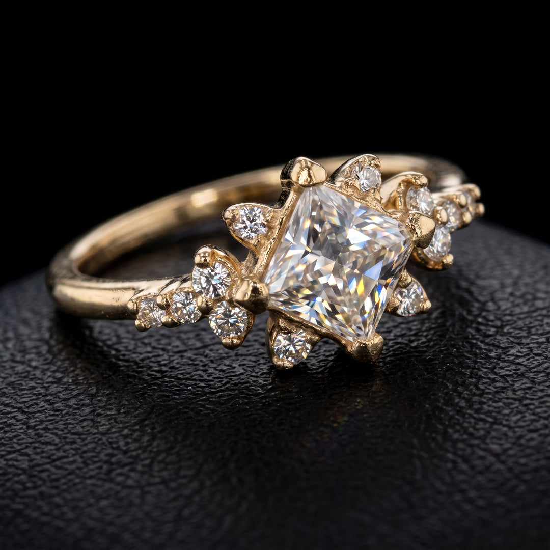Moissanite engagement ring with 0.90CT center stone, accent stones, set in 14K gold.