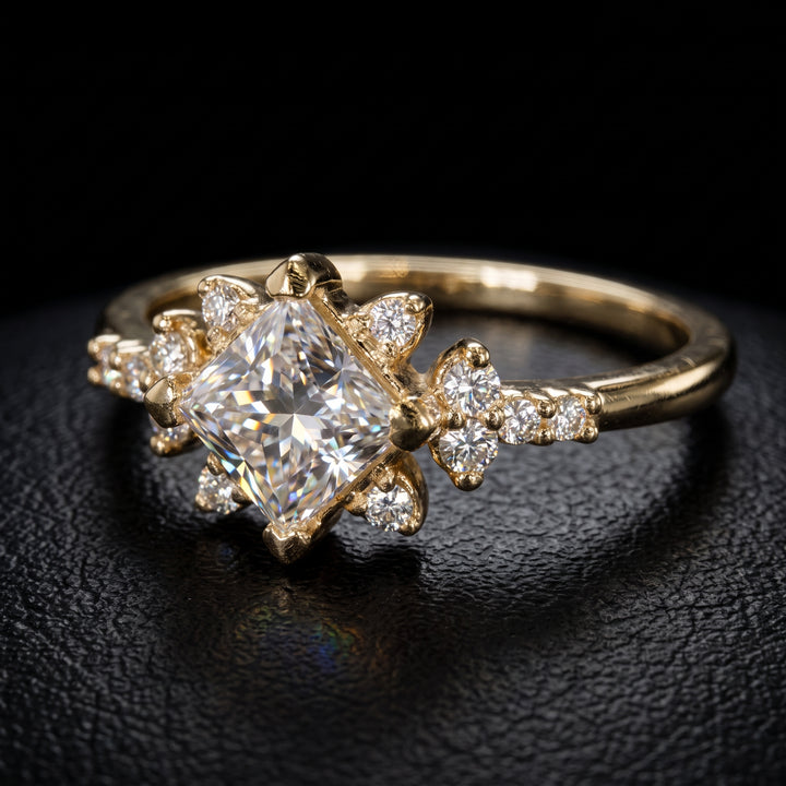 Moissanite engagement ring with 0.90CT center stone, accent stones, set in 14K gold.