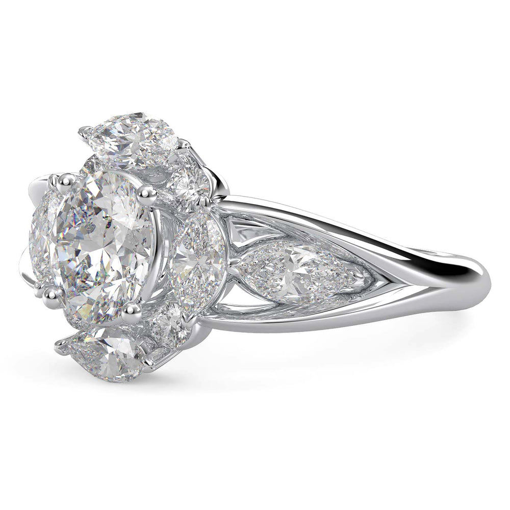 Oval lab-grown diamond ring with marquise and round halo, split shank design.