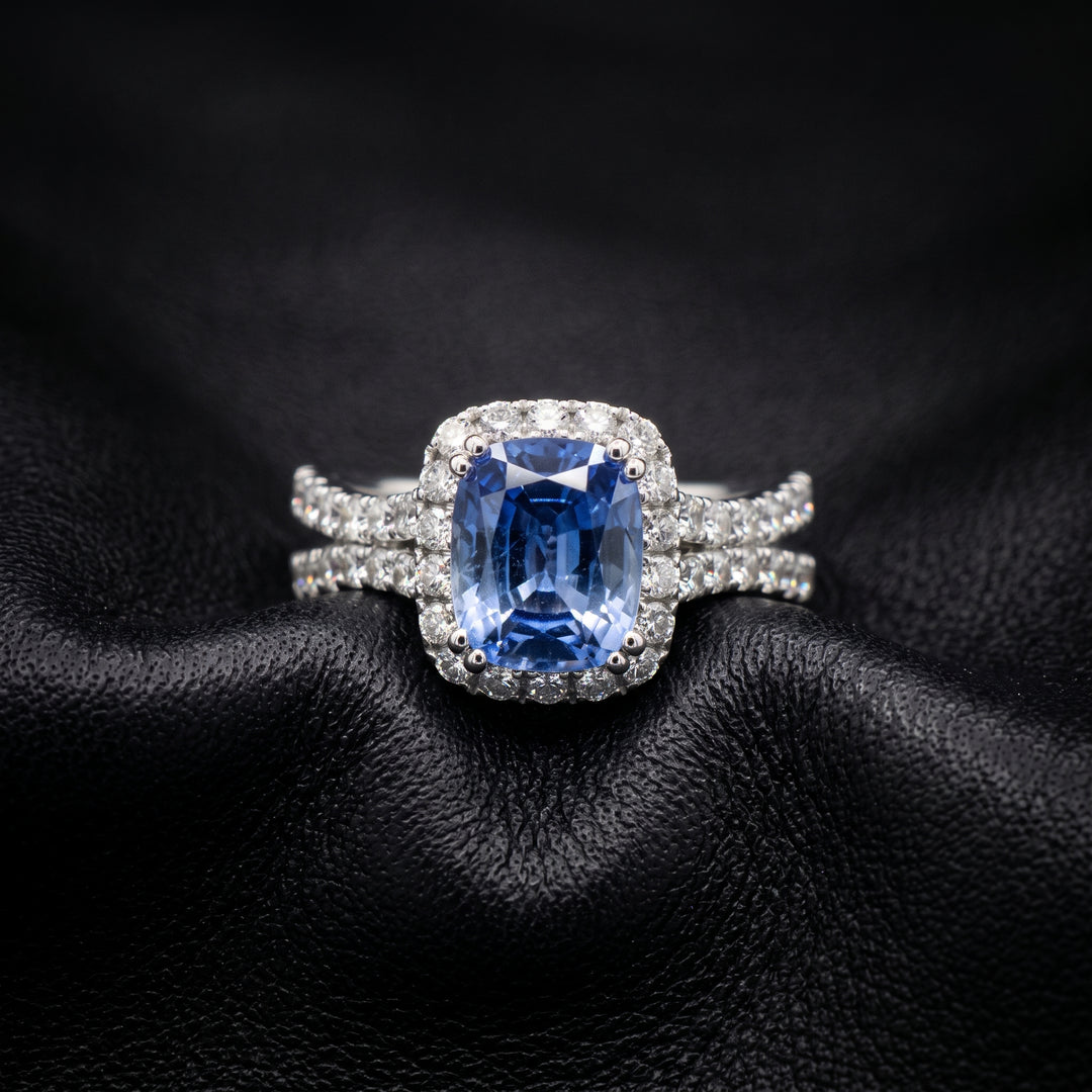 Cushion-cut 2.46 CT blue sapphire ring with 1.42 CT natural diamonds set in 14K white gold.