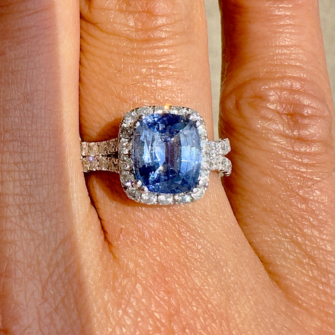 Cushion-cut 2.46 CT blue sapphire ring with 1.42 CT natural diamonds set in 14K white gold.