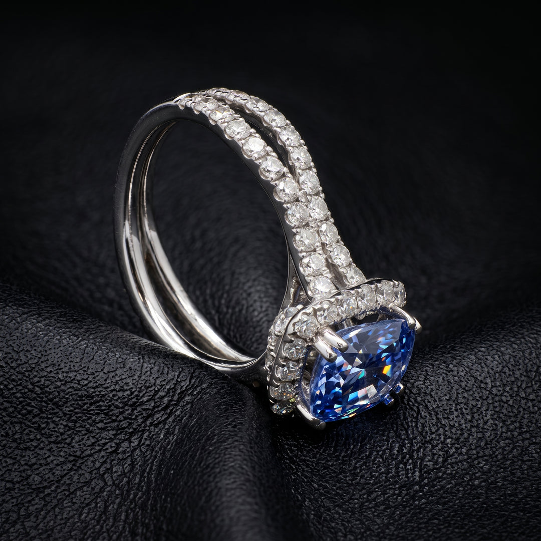 Cushion-cut 2.46 CT blue sapphire ring with 1.42 CT natural diamonds set in 14K white gold.