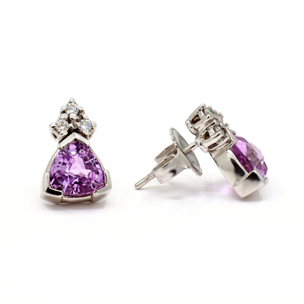 Trillion-cut purple sapphire and diamond stud earrings set in 14K white gold.