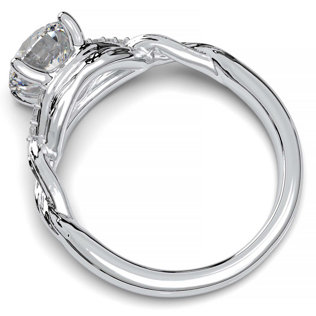 Twisted engagement ring with 1.2 carat round lab-grown diamond and side diamond clusters.