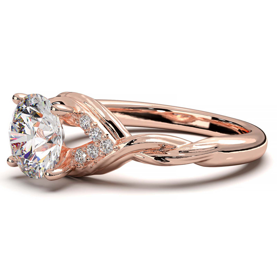 Twisted engagement ring with 1.2 carat round lab-grown diamond and side diamond clusters.