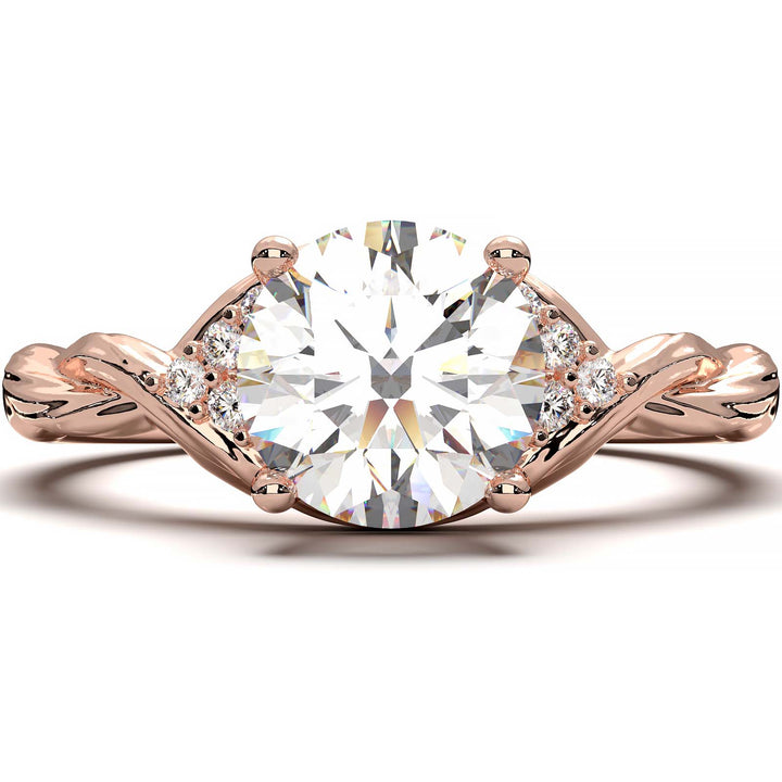 Twisted engagement ring with 1.2 carat round lab-grown diamond and side diamond clusters.