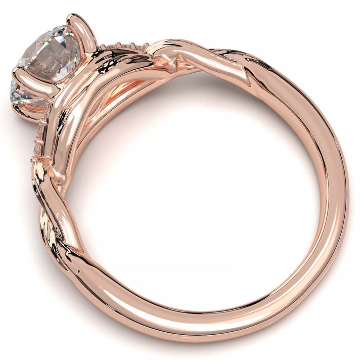 Twisted engagement ring with 1.2 carat round lab-grown diamond and side diamond clusters.