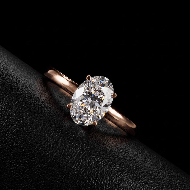 2.2 Ct oval solitaire moissanite engagement ring in 18K gold.