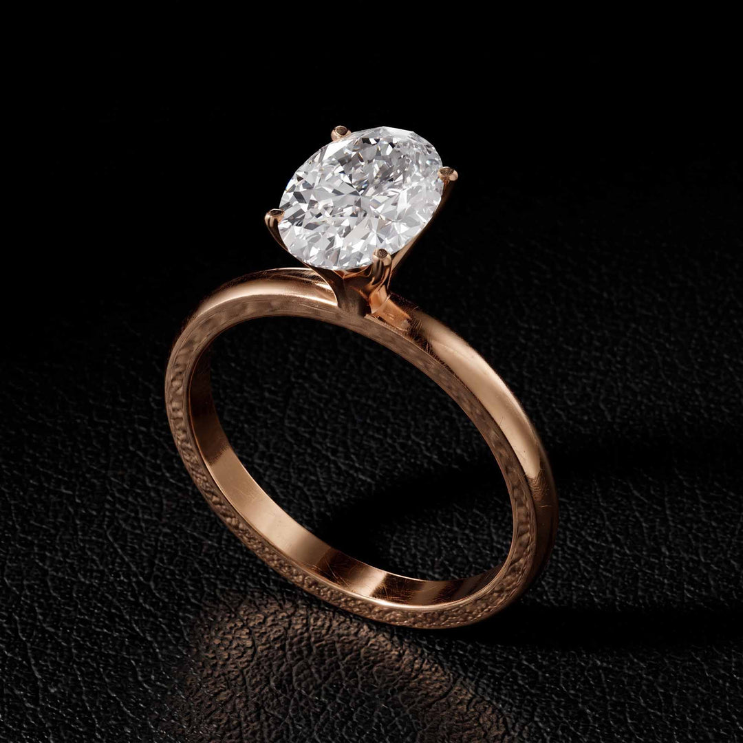 2.2 Ct oval solitaire moissanite engagement ring in 18K gold.