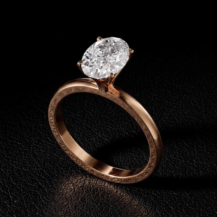 2.2 Ct oval solitaire moissanite engagement ring in 18K gold.